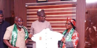 Chairman, National Sports Commission, Mallam Shehu Dikko being presented a uniform by the President of National Association of Physical health Education, Recreation Sports and Dance Prof. Florence Bola Adeyanju (Right) and Dr. Mohammed Sanusi, the National vice president of the Association, when they paid a congratulatory visit to the Chairman in his office, at MKO Abiola National Stadium, Abuja