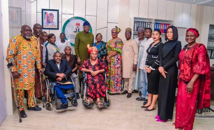 ( 2nd row, 9th Right), Honourable Minister of Humanitarian Affairs and Poverty Reduction Prof. Nentawe Goshwe Yilwatda, (8th Right) Felicia Yakzum, (front row 1st left), Convener of the National Disability Civil Rights , Job Napoleon, (front row,1st Right) leader of the Pioneer of Nigeria National Disability Civil Rights Movements, Lady Omotunde Ellen Thompson, and other dignitaries during the courtesy visit on the Minister, Tuesday 19th November 2024 at the Ministry's Headquarters Abuja