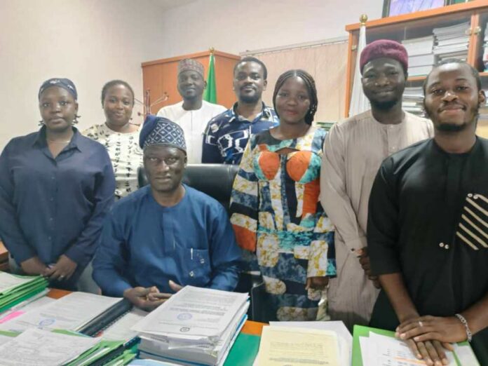 ambassadors of BPP Acting Director General, Bureau of Public Procurement , Barr. Olusegun Omotola seated , around him are the just concluded NYSC members who served in the Bureau. The Ag DG hosted them November, 1 , 2024.