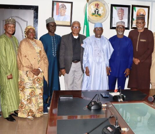 Minister of Labour and Employment, Dr. Muhammad Maigari Dingyadi (5th right); Director Overseeing the Office of the Permanent Secretary, John Nyamali (6th right); Executive Director, Mobil Producing Nigeria, Bala Aliyu (4th right) and members of his team with Directors of the Ministry during a courtesy visit by Mobil Producing Nigeria to the Minister, Abuja