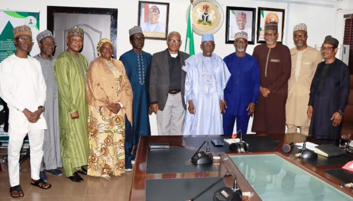 courtesy visit by Mobil Producing Nigeria Minister of Labour and Employment, Dr. Muhammad Maigari Dingyadi (5th right); Director Overseeing the Office of the Permanent Secretary, John Nyamali (6th right); Executive Director, Mobil Producing Nigeria, Bala Aliyu (4th right) and members of his team with Directors of the Ministry during a courtesy visit by Mobil Producing Nigeria to the Minister, Abuja