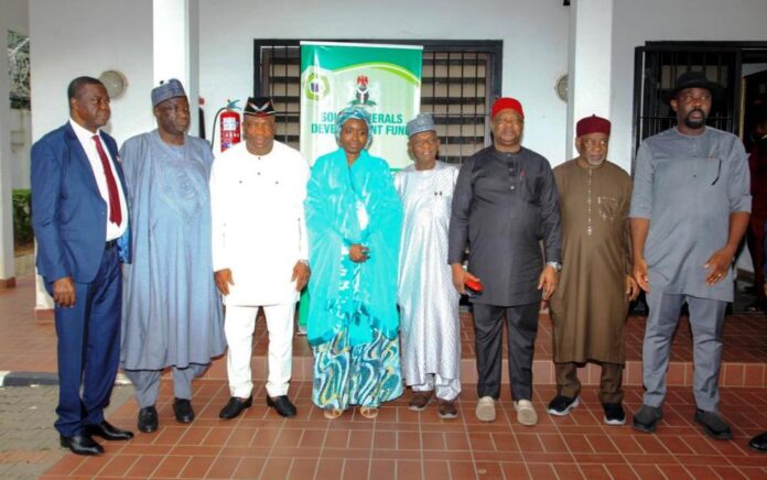 oversight visit to SMDF1 The Chairman, Senate Committee on Solid Minerals, Sen. Sampson Ekong (3rd left), Vice Chairman of the Senate Committee on Solid Minerals, Sen. Kabeeb Mustapha (4th right), Executive Secretary, Solid Minerals Development Fund (SMDF), Hajia Fatima Shinkafi (middle) and other members of the Committee during their oversight visit to SMDF