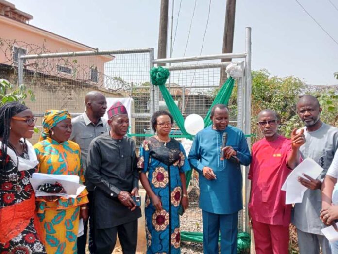3rd Left, Representative of Prof. Nentawe Goshwe Yilwatda, Honourable Minister of Humanitarian Affairs and Poverty Reduction, the Director General Services, of the Ministry, Mr. Yakubu A. John, 3rd left, Deputy Director Overseeing the Office of the Director, Social Development, of the Ministry Mr. Peter Adanu Audu, Representative of Dr. Barr. Ndubueze Mbah, Hon. Commissioner for Education, Enugu State, Mrs. Ifeoma B. OnuIgbo (Area Lead Evaluator), Enugu East (Ujodo), Overseeing Provost, Federal School of Social Work, Emene (FSSWE), Enugu, Mr. Chris Ajibola and 1st right, Mr. Oparaku Modestus ( represented Engr. osita in Obiukwu) from NEMSA, during the commissioning of 100KVA Transformer purchased by the Ministry for the School of Social Work Emene, Enugu State on Tuesday 10th December 2024