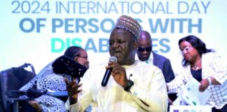 The Executive Secretary of the National Commission for Persons with Disabilities, Hon. Ayuba Gufwan, delivering the welcome address at the 2024 National Dialogue in commemoration of the International Day of Persons with Disabilities.