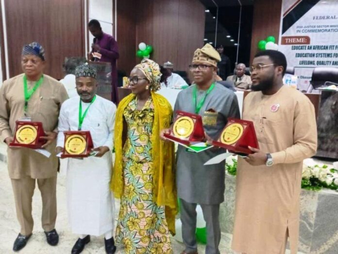 The Solicitor General of the Federation and Permanent Secretary, Federal Ministry of Justice, Mrs. Beatrice Jedy-Agba, OON, mni in a group photograph with some of the Award Recipients at the 2024 Justice Sector Ministerial Award and Recognition Ceremony held on Friday 13th December, 2024 in Abuja.
