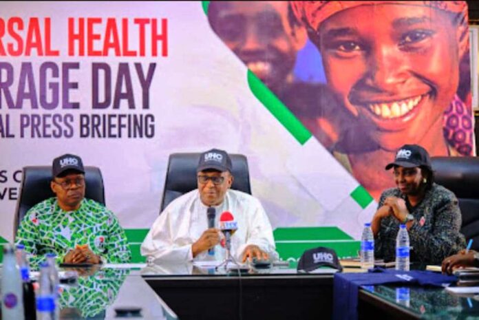 2024 Universal Health Coverage Day1 2024 Universal Health Coverage Day Ministerial Press Briefing: The Coordinating Minister for Health & Social Welfare Prof. Muhammad Ali Pate addressing Journalists, held inside the Ministry's headquarters building, Abuja. Assisted by Honourable Minister of State for Health & Social Welfare, Dr. Iziaq Adekunle Salako & Permanent Secretary Daju Kachollom mni.