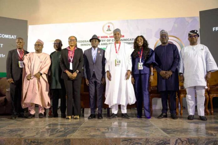 R - L: His Excellency, The Executive Governor of Benue State Rev fr Dr. Hyacinth Iormem Alia and The Permanent Secretary, Federal Ministry of Communications, Innovation and Digital Economy Engr. Faruk Yusuf Yabo all (middle) in a group photograph with the Chief Executive Officers of the ministry's in Makurdi at the 12th NCCIDE