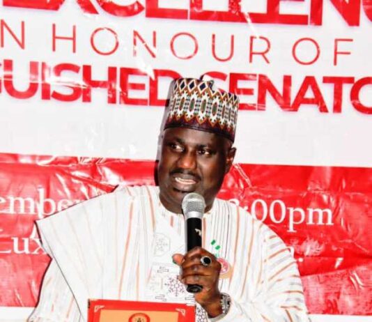 Hon. Minister of State for Agriculture and Food Security, Sen. Dr. Aliyu Sabi Abdullahi (CON), with the plaque depicting the Award of Excellence For Strategic Synergy For Good Governance, presented by the Senate Press Corps on December 16, 2024, at NICON Luxury Hotel, Abuja.