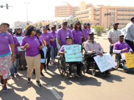 Executive Secretary, National Commission for Persons with Disabilities, Hon. Ayuba Burki Gufwan (right); Representative of the Senior Special Assistant to the President on Special Needs, Onah Chioma Emmanuel (2nd right), with members of staff of the Ministry and others during the roadshow to mark the 2024 International Day of Persons with Disabilities - Abuja