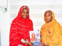 Honourable Minister of State for Education Dr Suwaiba Said Ahmad (R) receiving a presentation from the Deputy National Women leader (APC) 12/12/24