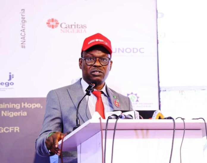 Commemorating Worlds AIDS DAY: The Honourable Minister of State for Health & Social Welfare, Dr. Iziaq Adekunle Salako delivering key note address at the event, which held at NAF Centre Abuja.