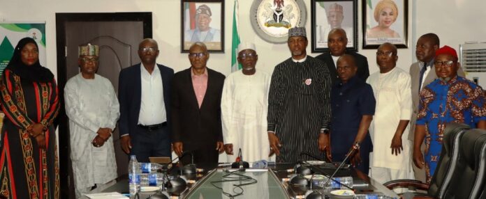 Implementation of New Minimum Wage Minister of Labour and Employment, Muhammad Dingyadi (5th left); Director Overseeing the Office of the Permanent Secretary, John Nyamali (4th left); National President, Association of Senior Civil Servants of Nigeria (ASCN), Comrade Shehu Mohammed (6th left) with the Directors of the Ministry and other members of ASCN, during their visiting to the Minister, Abuja