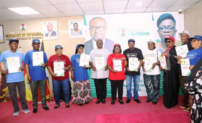 Interior Performance Management System (PMS) Day In the middle is the Permanent Secretary, Ministry of Interior, Dr. Magdalene Ajani in a group photograph with Directors of the Ministry of Interior at the Directors' Performance Contract Signing Ceremony