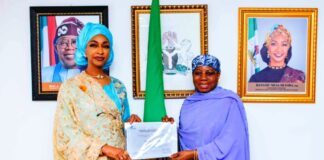R-L H.E. Dr. Hajo Sani, OON Permanent Delegation of Nigeria to UNESCO presenting the inscription certificate of the Intangible Cultural Heritage of Durbar in Kano to Barr. Hannatu Musa Musawa Minister of Art, Culture, Tourism and the Creative Economy at the Ministry on the 17th of December 2024.