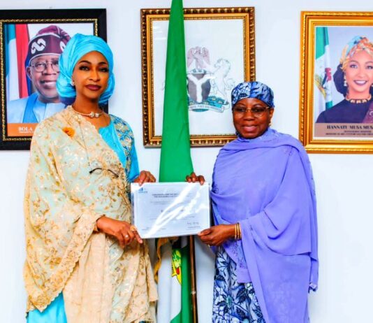 R-L H.E. Dr. Hajo Sani, OON Permanent Delegation of Nigeria to UNESCO presenting the inscription certificate of the Intangible Cultural Heritage of Durbar in Kano to Barr. Hannatu Musa Musawa Minister of Art, Culture, Tourism and the Creative Economy at the Ministry on the 17th of December 2024.