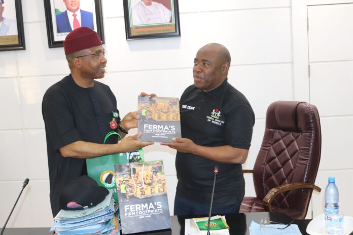 Pix 2 L-R, Managing Director/CEO, FERMA, Dr. Emeka Agbasi, FNSE, presenting one of FERMA’s publications (FERMA’s Firm Footprints) to the Perm. Sec. Federal Ministry of Works, Engr. Adebiyi Olusesan Olufunso, during the Perm. Sec’s interactive session with the MD/CEO, Directors and Heads of Units of the FERMA on Thursday 16th January, 2025