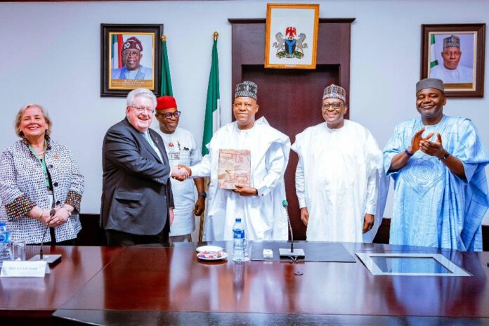 courtesy visit2 Vice President Kashim Shettima (middle) in a handshake with Chair of Trustees of Rotary Foundation of Rotary International, Mark Daniel Maloney; and Chairman of the Sir Emeka Offor Foundation (SEOF), Emeka Offor; Coordinating Minister of Health and Social Welfare, Prof Muhammad Ali Pate(2nd from left); Deputy Chief of Staff to the President (Office of the Vice President), Sen. Ibrahim Hassan Hadejia (far left) and wife of Chair of Trustees of Rotary Foundation of Rotary International, Gay Maloney (far right) during a courtesy visit to the Vice President at the Presidential Villa, Abuja, on Friday, 17/01/2025.