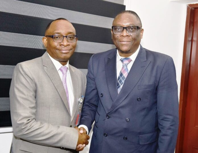 L-R; Director-General, Bureau of Public Procurement, BPP, Dr. Adebowale A. Adedokun, MCIPS, ACFE in a warm handshake with Regional Procurement Coordinator African Development Bank, AfDB, Mr. Kelvin Lumbila, during his visit to the BPP today, 17th February, 2025