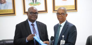 L-R: Permanent Secretary, Ministry of Police Affairs, Dr. Anuma Ogbonnaya Nila receiving hand over note from the Director overseeing the office of the Permanent Secretary, Mr. Okehie Isaac Tochukwu during a meeting with the Management and staff of the Ministry on his assumption of duty at the Ministry of Police Affairs Headquarters in Abuja