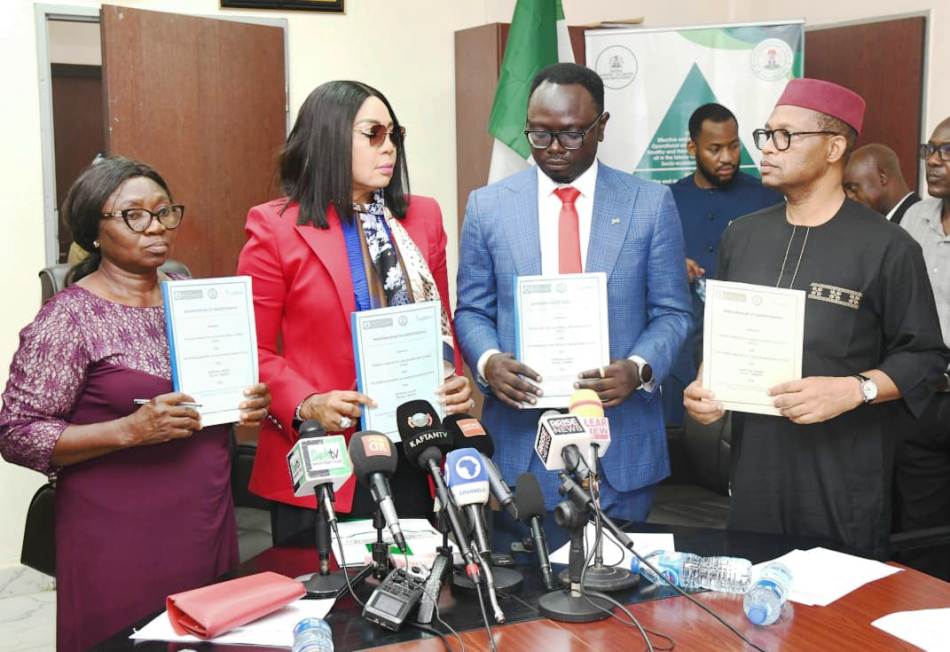 L-R, Permanent Secretary Federal Ministry of Youth Development, Olubunmi Olusanya, Hon. Minister of Youth Development, Comrade Ayodele Olawande, Hon. Minister of State, Labour and Employment, Hon. Nkiruka Onyejeocha and Director Overseeing the Office of the Permanent Secretary, Ministry of Labour and Employment Mrs. Laurenta Adogu displaying signed copies of MoU.