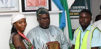 L-R: Assistant Lecturer of the Department of Surveying and Geo-informatics of the Institution, Miss Augustina Ajiroghene, the Surveyor General of the Federation, (SGOF) Surv. Abuduganiyu Adebomehin and the President of NISGS, Jethro Stephen during the presentation of gift