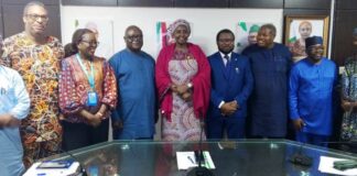 Group Photograph: Official Inauguration Ceremony of PMTCT-TWG members Middle: Permanent Secretary Daju Kachollom mni; on her right: Dr. Michael Akpan Director Port Health Services Division, representing the Director Public Health Dept. & Chair PMTCT- TWG; left of Permanent Secretary: Dr. Adebobola Adebashorun Director National Coordinator NASCP & Vice-Chair PMTCT-TWG; supported by other members