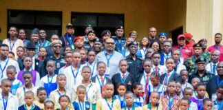 Students And Pupils In A Group Photograph With AIG, SSG And Other Stakeholders.