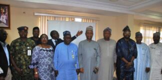 Group photograph of participants with Surveyor General of the Federation (SGOF), Surv. Abuduganiyu Adeyemi Adebomehin after the event