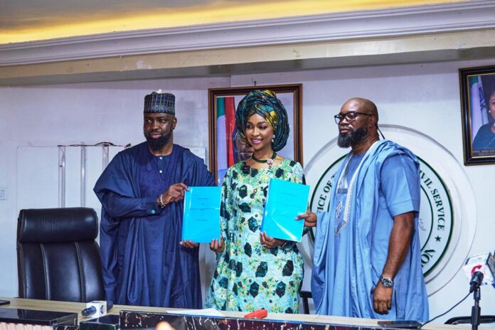 Audu Maikori, Chairman, Chocolate City Group (left); Barr. Hannatu Musa Musawa, Honourable Minister of Art, Culture, Tourism and the Creative Economy (center); and Paul Okeugo, Vice Chairman, Chocolate City Group (right), at the signing of an MoU to develop infrastructure critical to Nigeria's creative industry in Abuja on Thursday.