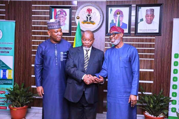 L-R Honorable Minister of Solid Minerals Development Dr. Henry Oladele Alake. The person in the middle is the Honorable Minister of Resources and Energy of Republic of South Africa H.E. Hon. Gwede Mantashe, MP next to him is the Hon. Minister of Steel Development, Prince Shuaibu Abubarka Audu