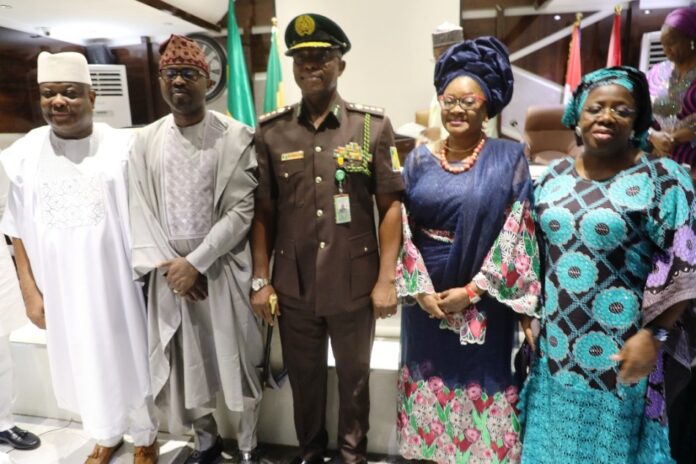 New CG NCoS L-R: Senator Osita Izunaso; Dr. Olubunmi Tunji-Ojo, Minister of Interior; CG Sylvester Nwakuche of NCoS; Mrs Nwakuche and Dr. Magdalene Ajani, Perm Sec, Ministry of Interior at the decoration ceremony of the new CG, NCoS