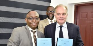 L-R: Director-General, Bureau of Public Procurement (BPP) Dr. Adebowale A. Adedokun, FCIPS, ACFE, and the Chief Executive Officer, Chartered Institute of Procurement and Supply (CIPS) UK, Mr. Ben Farrel displaying copies of Memorandum of Understanding (MoU) signed by the BPP and CIPS during the CIPS Team visit to BPP in Abuja