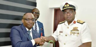 L-R: Director-General, Bureau of Public Procurement (BPP) Dr. Adebowale A. Adedokun, FCIPS, ACFE presenting a souvenir to the Commandant, Nigerian Navy Logistics College, NNLC, Rear Admiral EC Anakwe during his visit to BPP