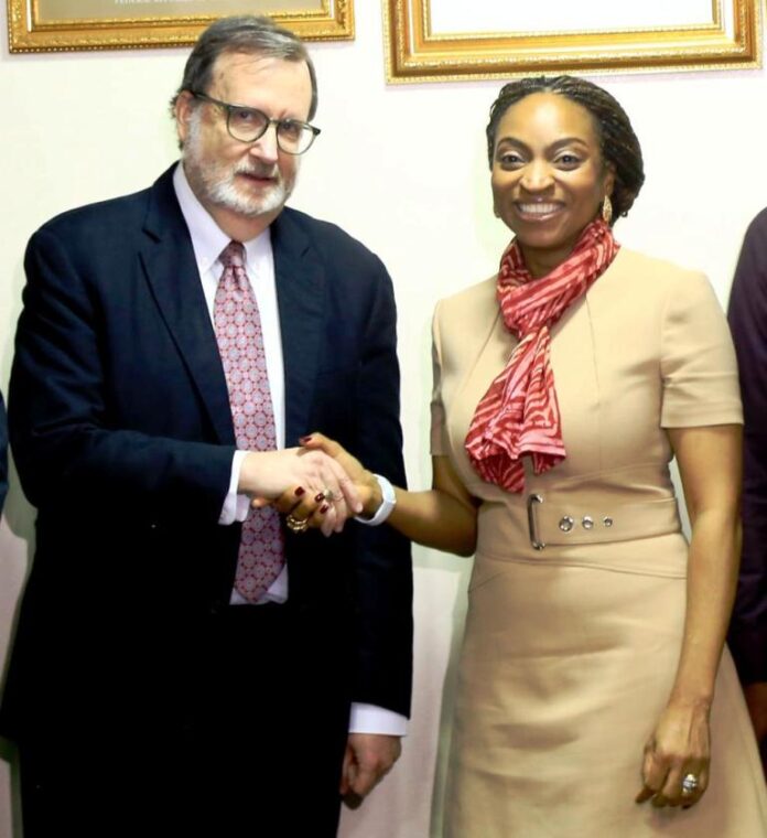 Consul General Amb. Rick Swart during their visit to FMITI2 The Hon. Min. of Trade & Investment, FMITI, Dr. Jumoke Oduwole in a handshake with the outgoing US ambassador to Nigeria , Amb. Richard M. Mills jr. during his visit to the Ministry on Monday 04/08/25 in Abuja.