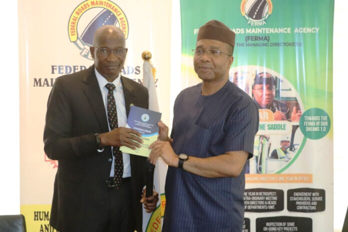 R-L The Managing Director/CEO, FERMA; Engr. Emeka Agbasi. Ph.D; FNSE; receiving the ACTU manual from Olusegun Adigun, Director SSRD (ICPC) representative of the Chairman ICPC